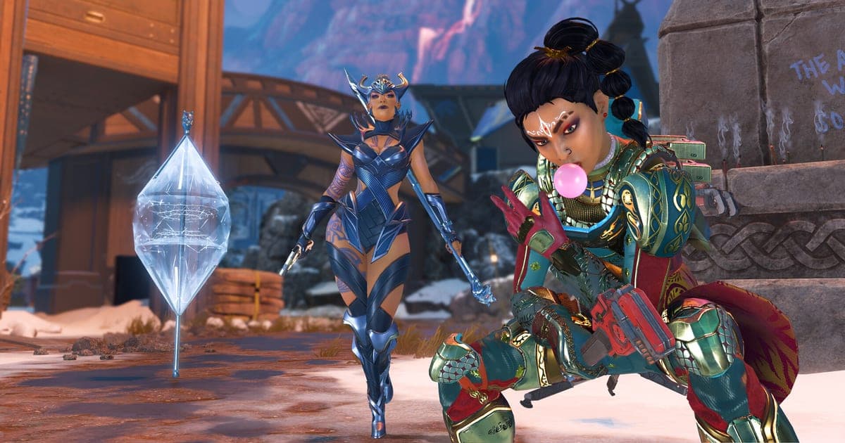 Apex Legendsの実際のゲーム画面 — 雪の積もった村で、風船ガムを膨らませるレジェンドと青い装甲のレジェンドが結晶の横に並んでいる場面