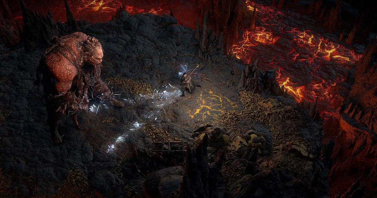 Un personaje con bastón dispara magia de hielo a un monstruo enorme en una cueva agrietada por la lava en Path of Exile 2