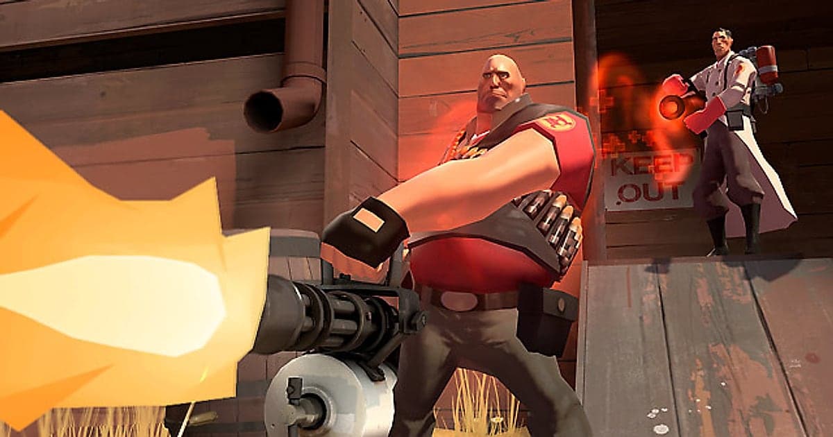 El Heavy de Team Fortress 2 disparando su minigun frente a un edificio de madera mientras un Medic con Medi Gun está en una cornisa detrás de él