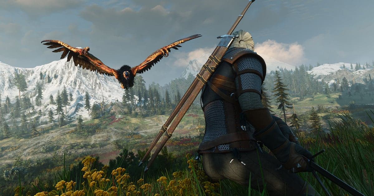 Escena de The Witcher 3 con Geralt agachado en una ladera de flores silvestres amarillas con dos espadas a la espalda, mientras un grifo se lanza con las alas abiertas frente a montañas nevadas