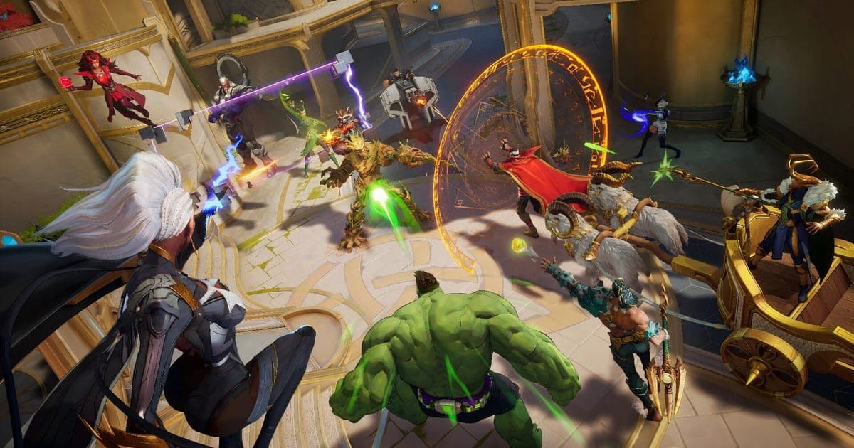 Actual Marvel Rivals gameplay — Hulk and other heroes clashing in a golden indoor arena as abilities fly in a full team fight
