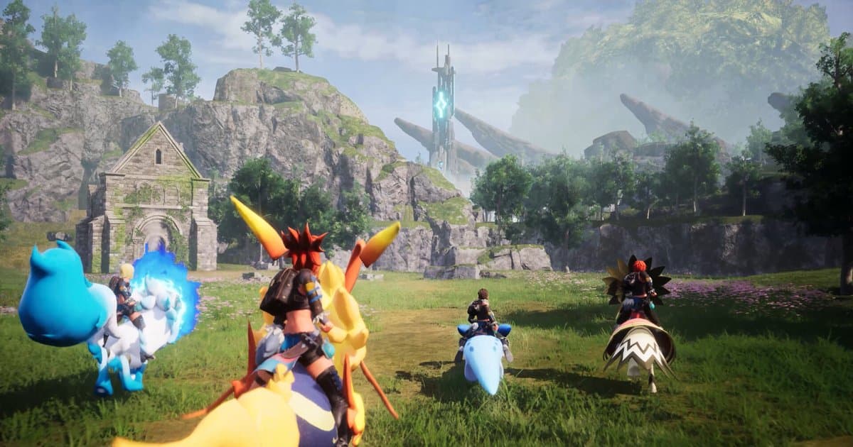 Official Palworld screenshot: four players ride their Pals across a grassy field past ruins toward a distant glowing tower