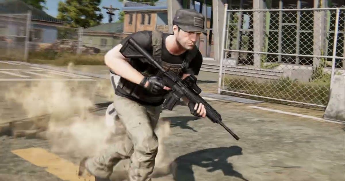 A PUBG: BATTLEGROUNDS character in a cap and black vest sprinting with a rifle past a chain-link fence, kicking up dust